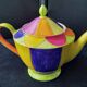 Polychrome porcelain teapot hand-painted.