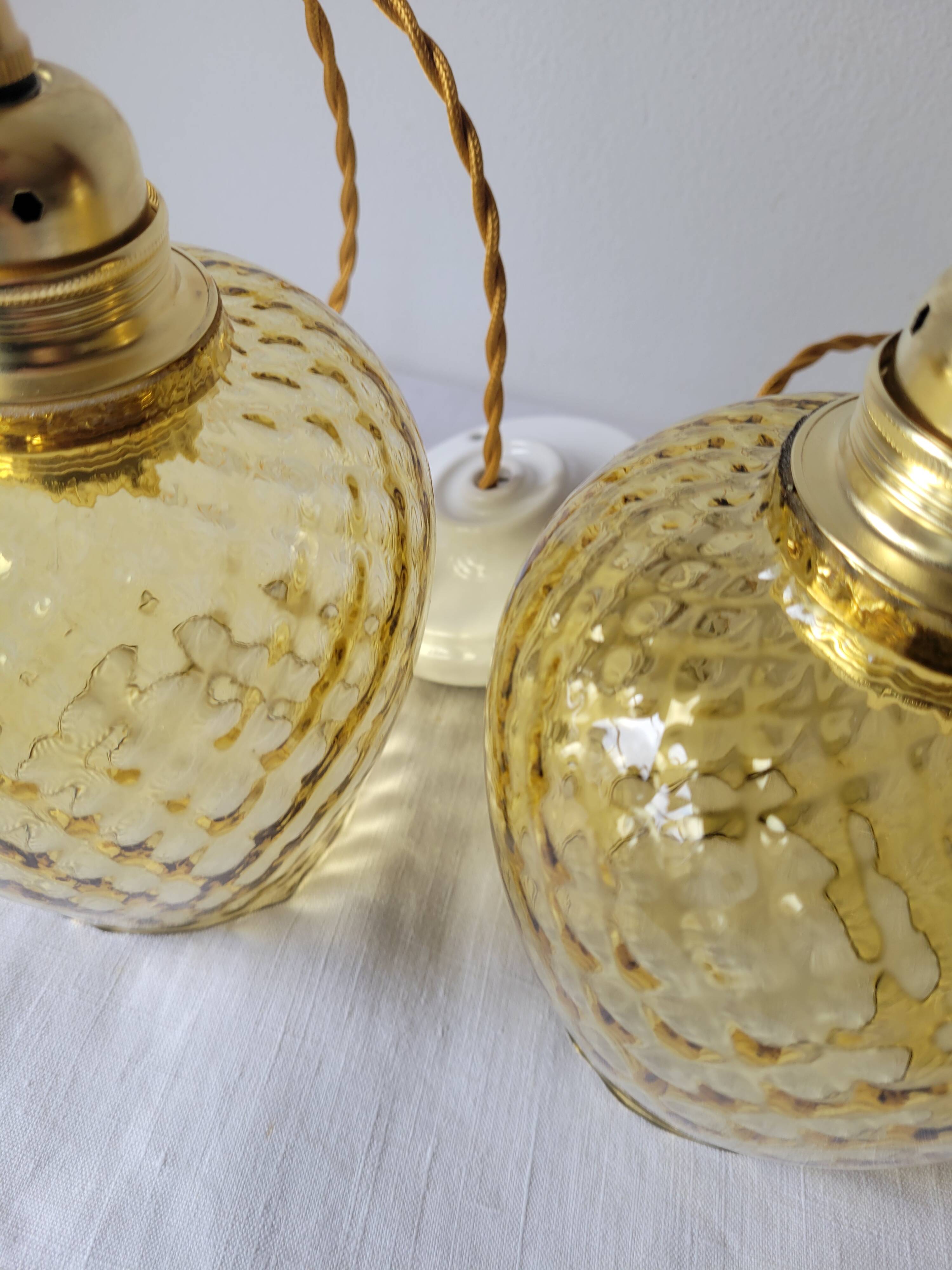 Trio of yellow glass pendant lights