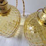 Trio of yellow glass pendant lights
