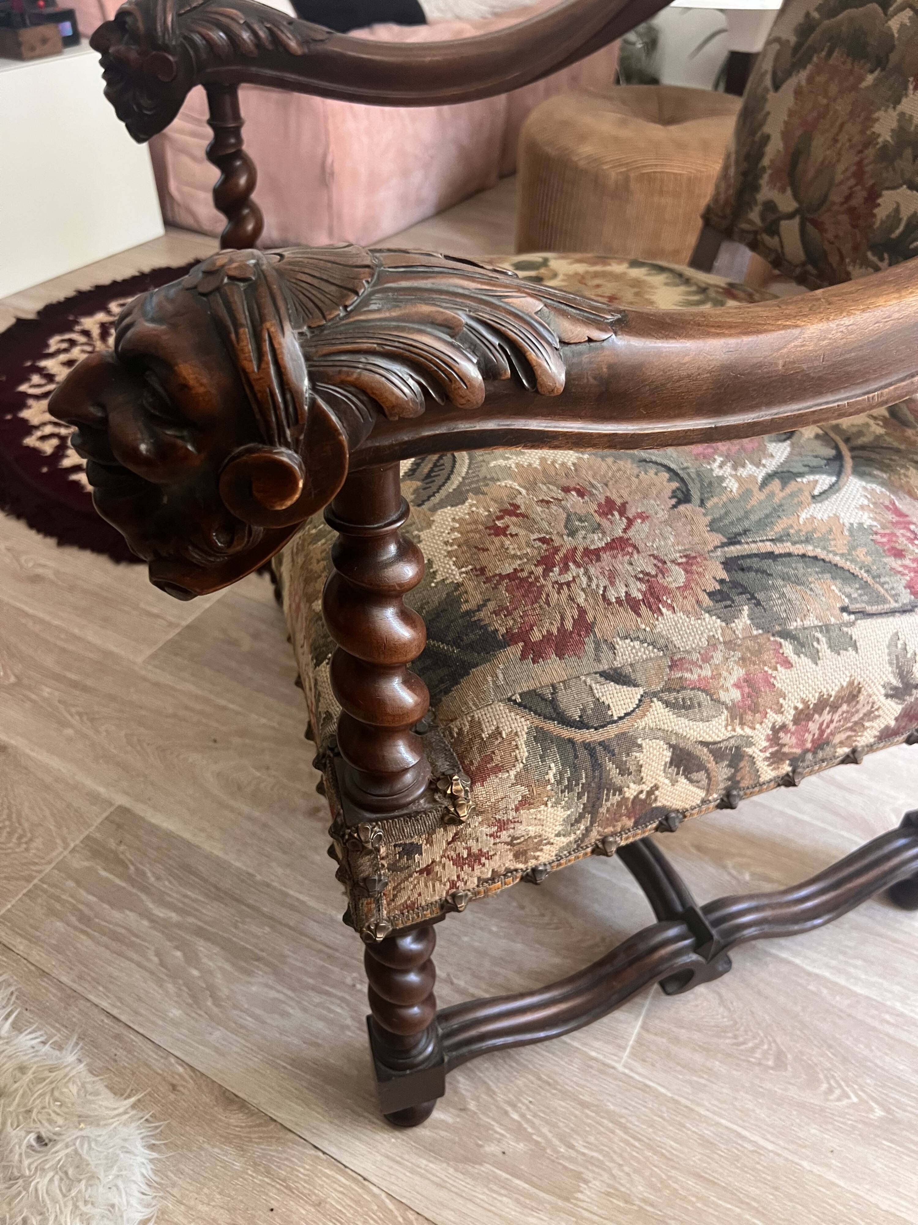 Antique armchair in Henri II style with masks