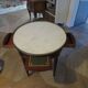 Empire/Restoration style console table with scrolled ends, mirrored back, and claw feet.