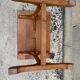 Small side table or bistro serving table with curved wood.