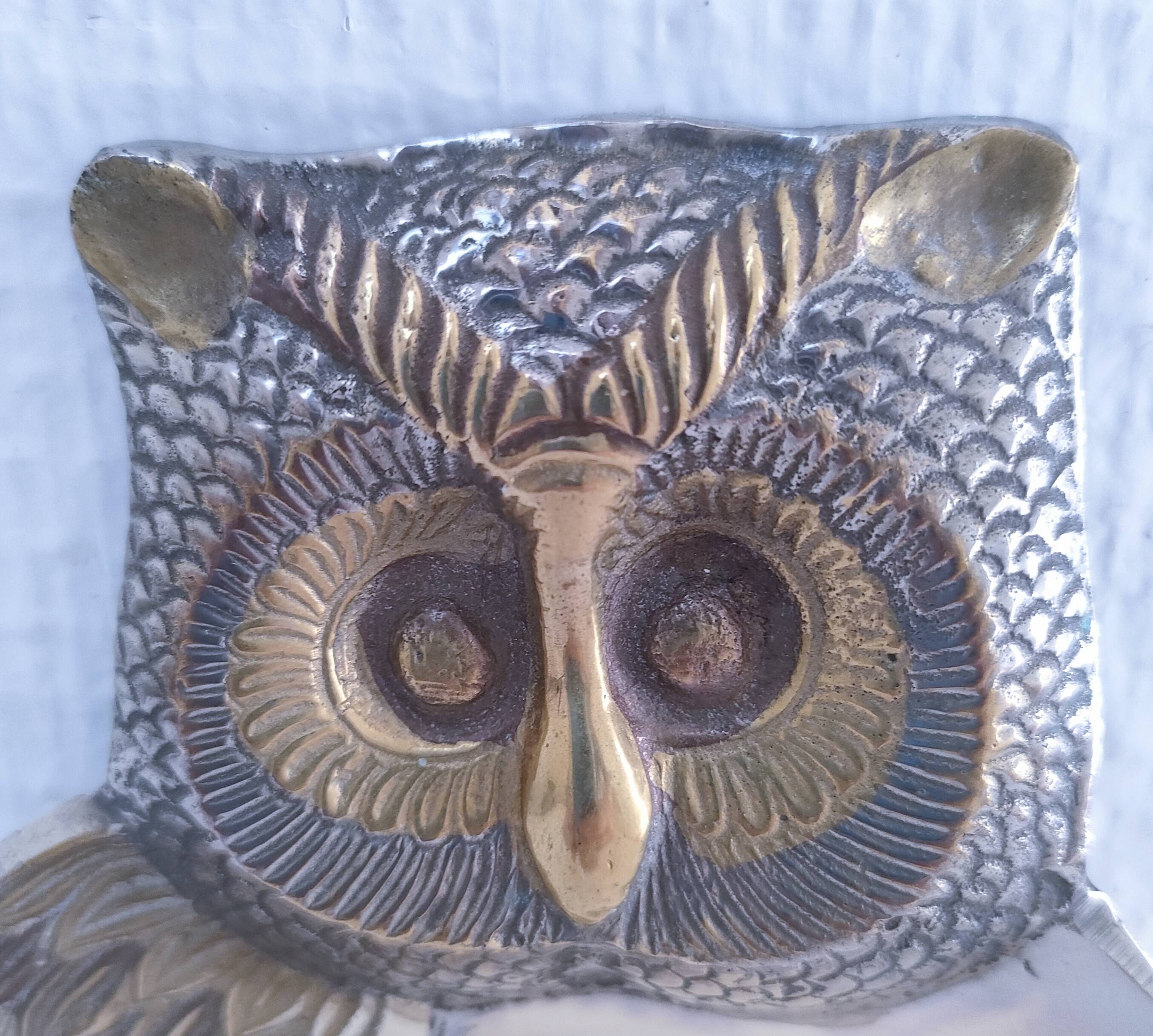 Empty pocket owl in gold and silver metal