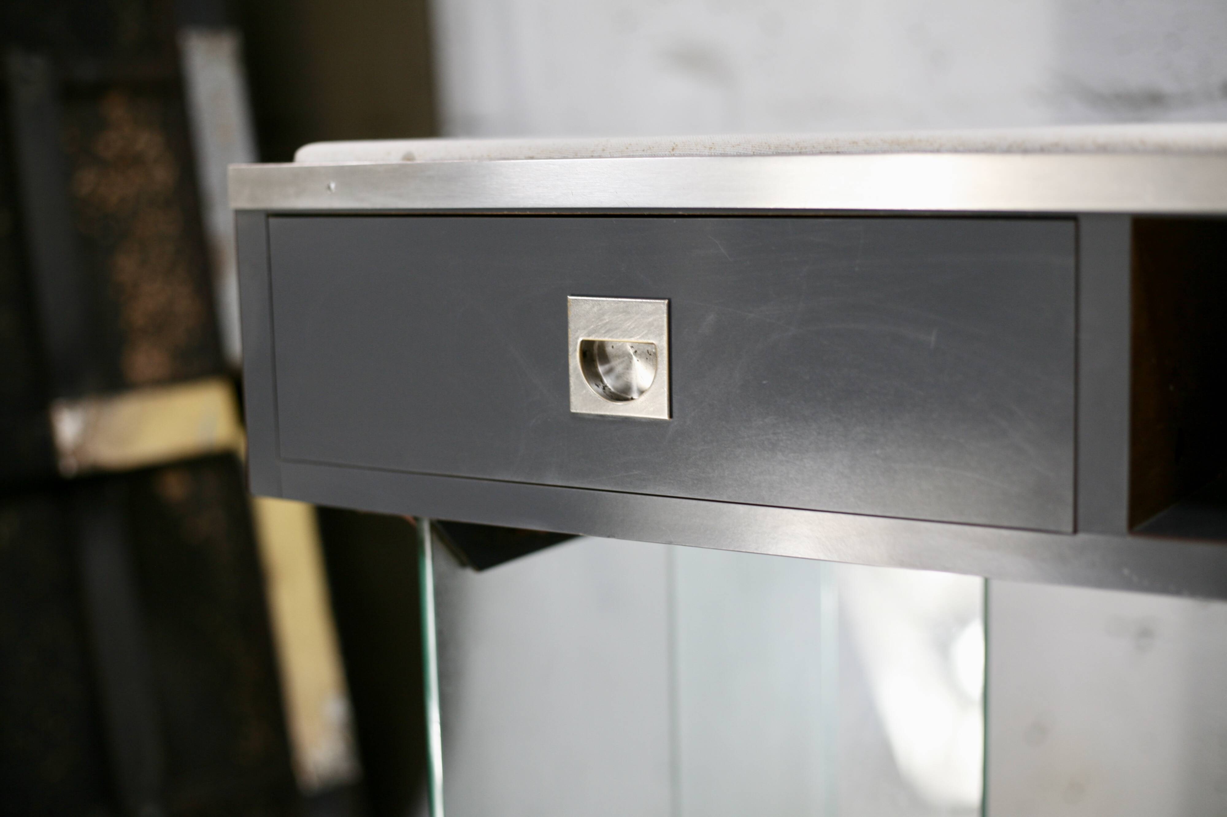 Modernist console, 1960s, glass base, wooden and fabric top.