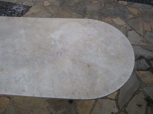 Old bistro table in marble and godin cast iron foot