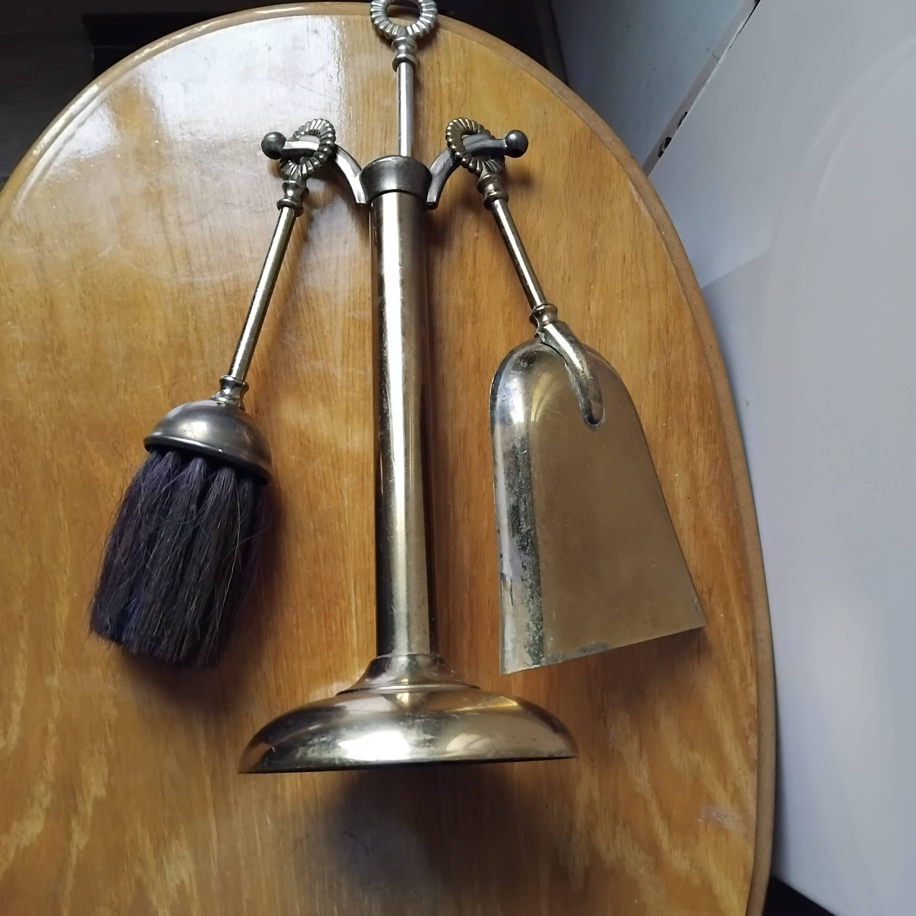 Small and discreet brass fireplace tool set.