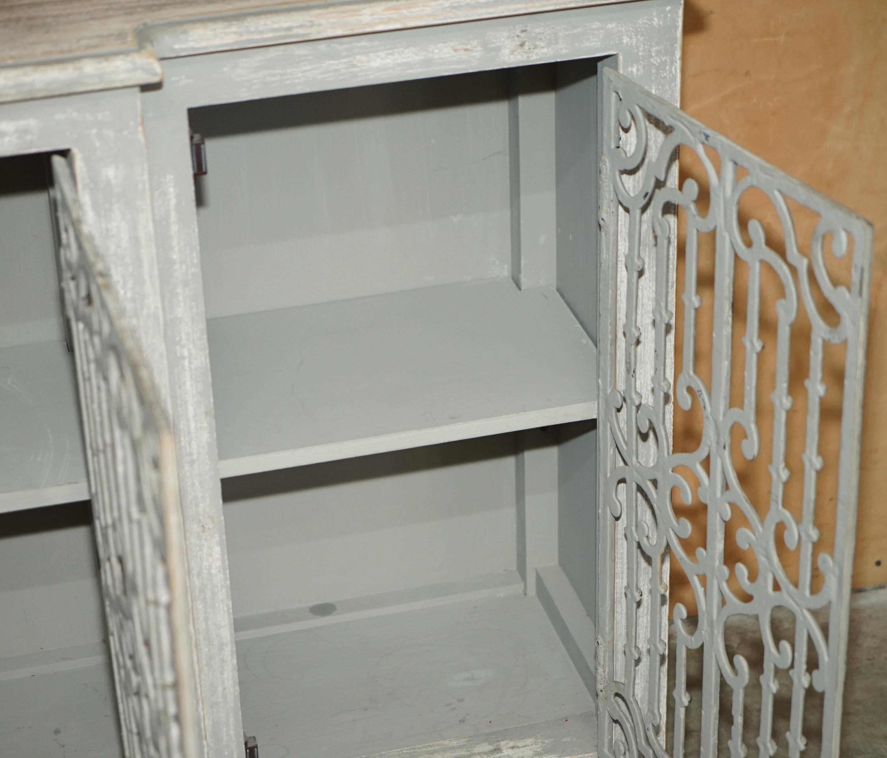 Vintage sideboard with wrought iron doors