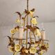 Vintage gilded hand-forged Florentine ceiling light with porcelain roses.