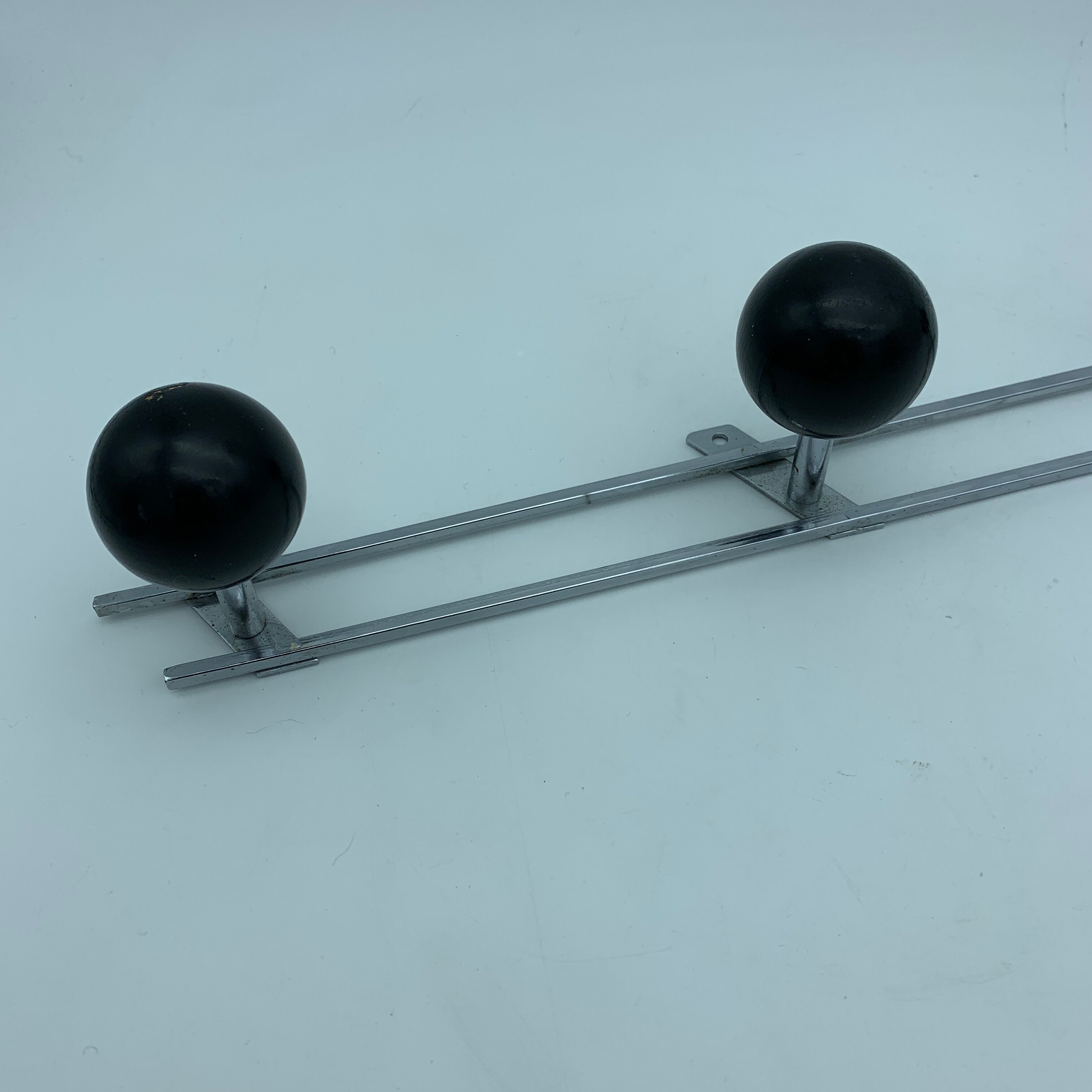 Coat holder 4 chrome steel pateres and black wooden balls
