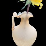 Old decorative carafe in li-colored glass