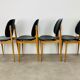 4 chaises Pégases Baumann, noires, années 60
