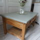Table basse vintage, piétement, ceinture, tiroir et tablette bois, plateau vert de gris.