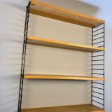 Floating wall shelf in oak veneer and black metal, 1960s.