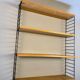 Floating wall shelf in oak veneer and black metal, 1960s