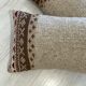 Pair of retro knitted wool cushions