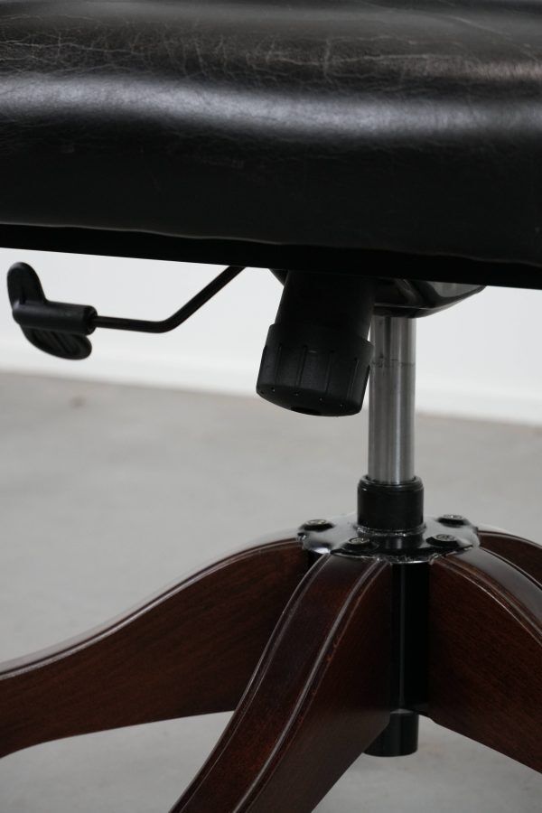 Adjustable black timeless Chesterfield office chair made of cow leather