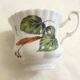 Tea cup, solitary service, naturalistic decoration, in Limoges porcelain.