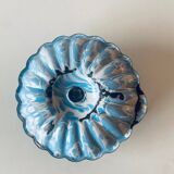 Old blue enameled metal candle holder