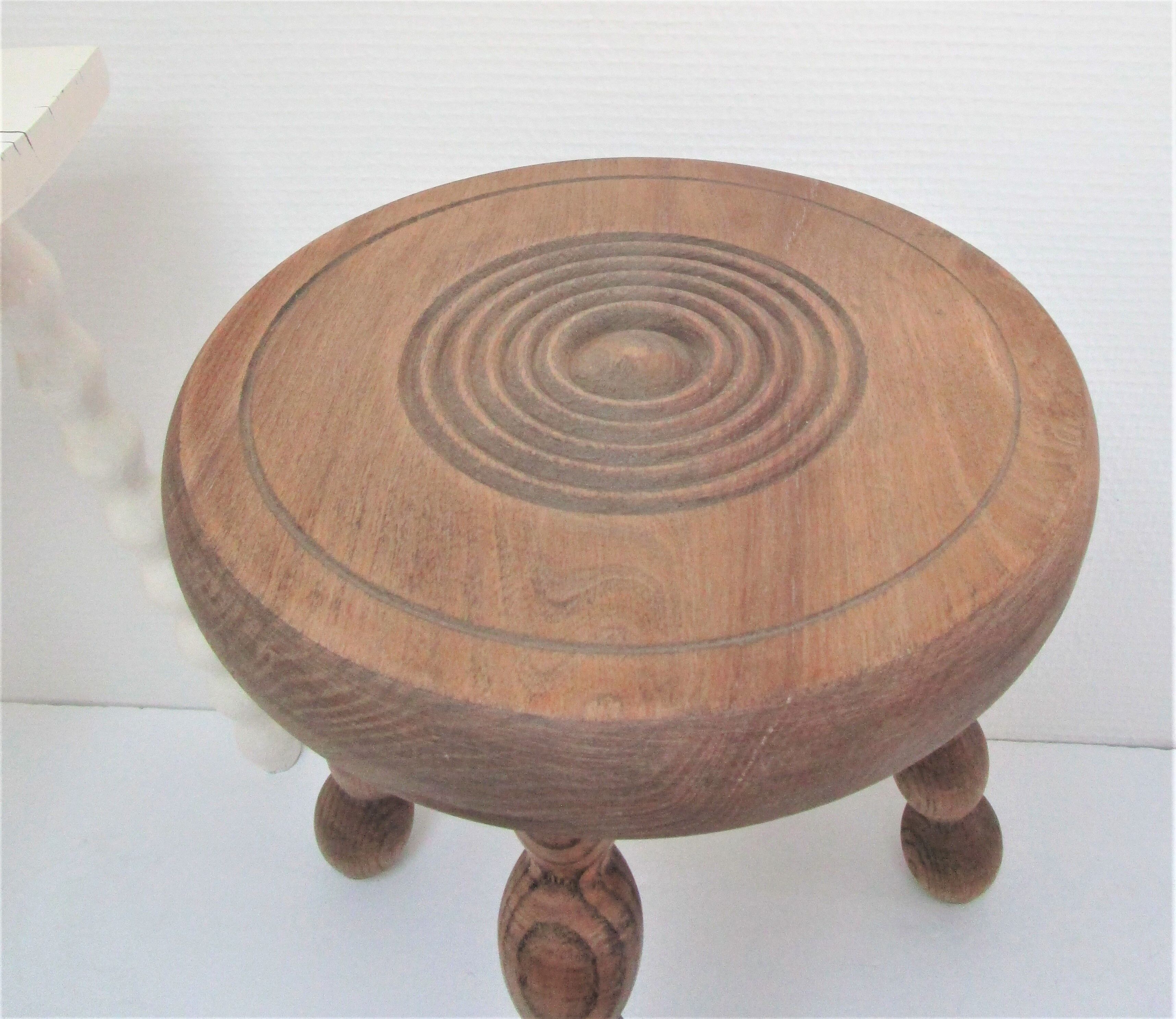 Two vintage tripod solid wood stools