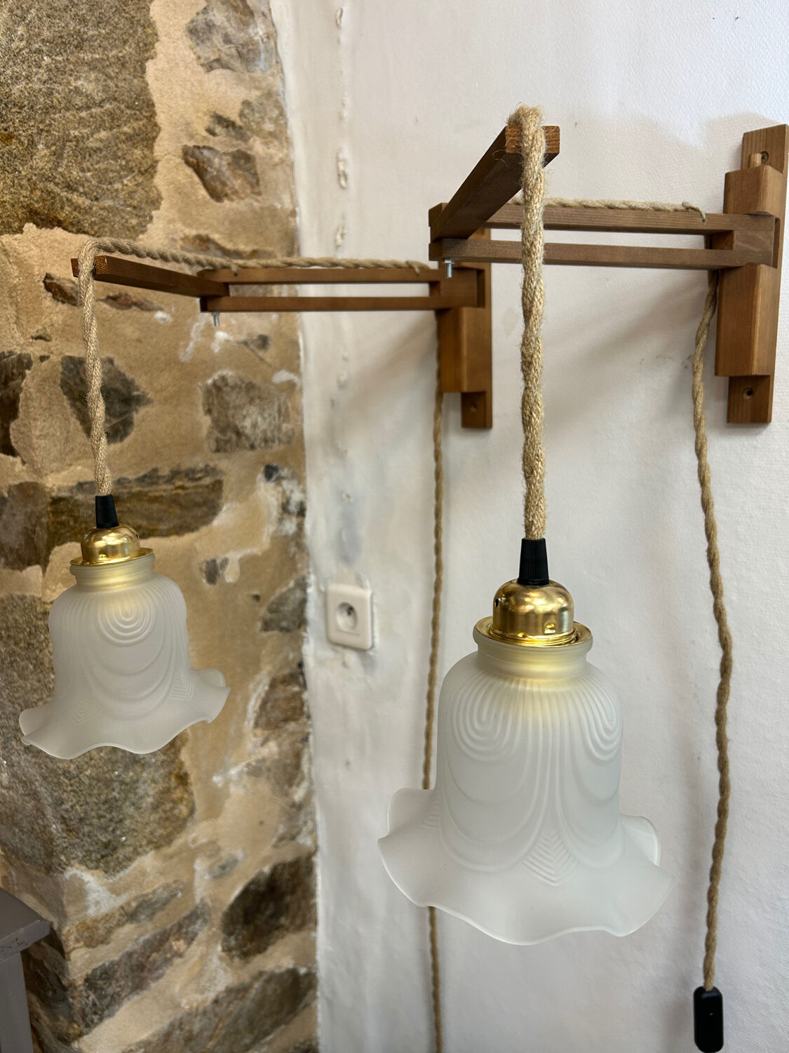 Two portable lamps with wall mount.