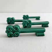 4 green ceramic knife rests in vintage key shape