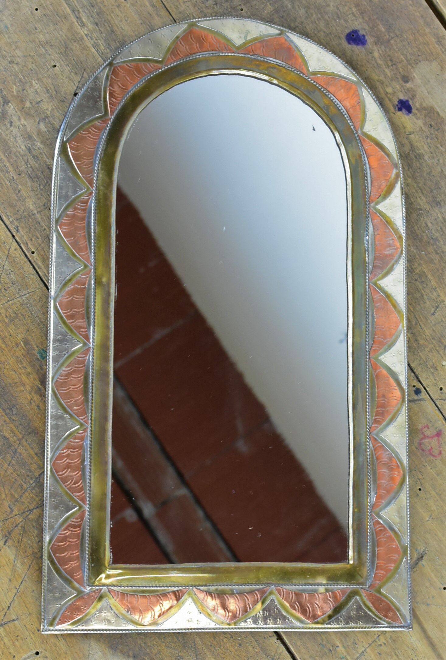 Decorated brass mirror.