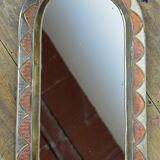Decorated brass mirror.