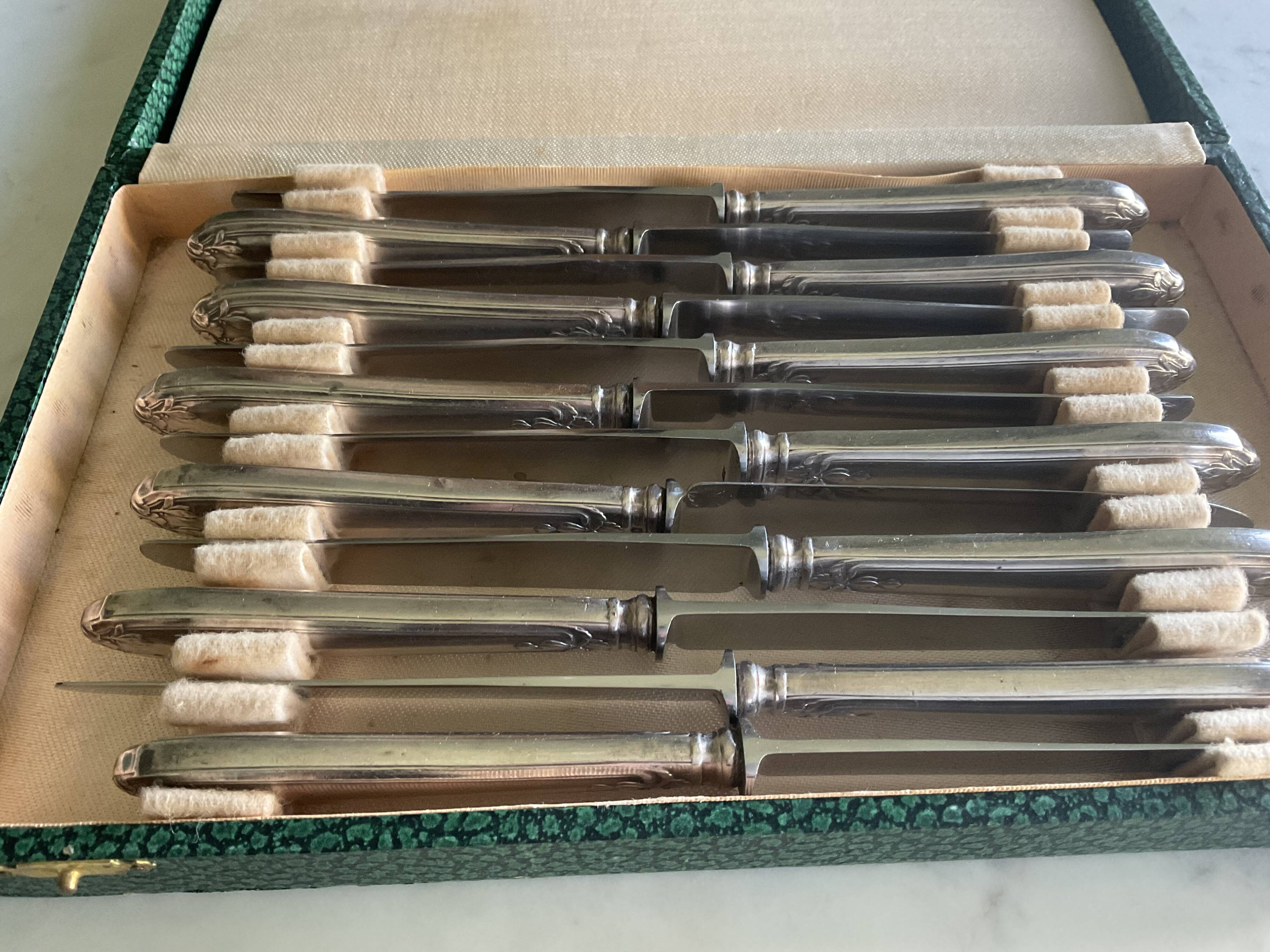 12 silver-plated metal knives. levert silversmith
