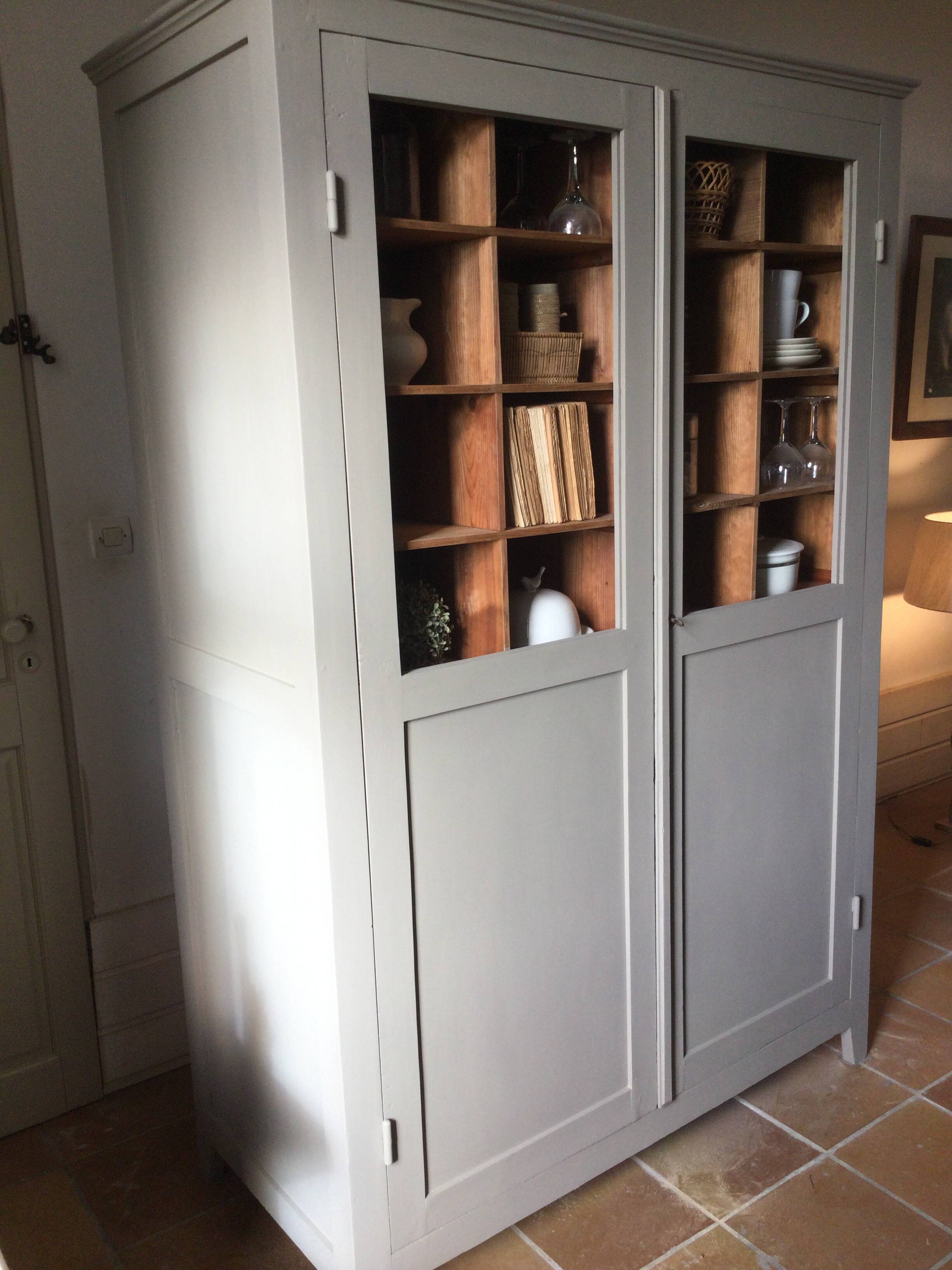Antique Parisian wardrobe with interior compartments.