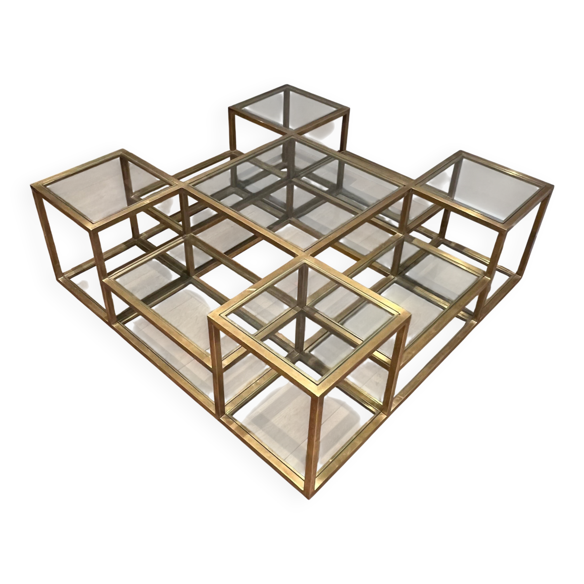 Important brass coffee table with multiple levels.