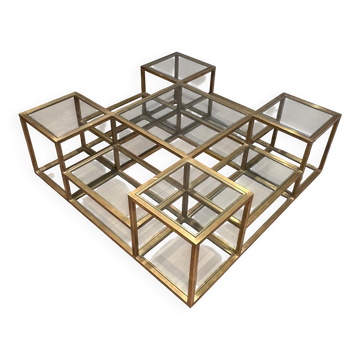 Important brass coffee table with multiple levels.