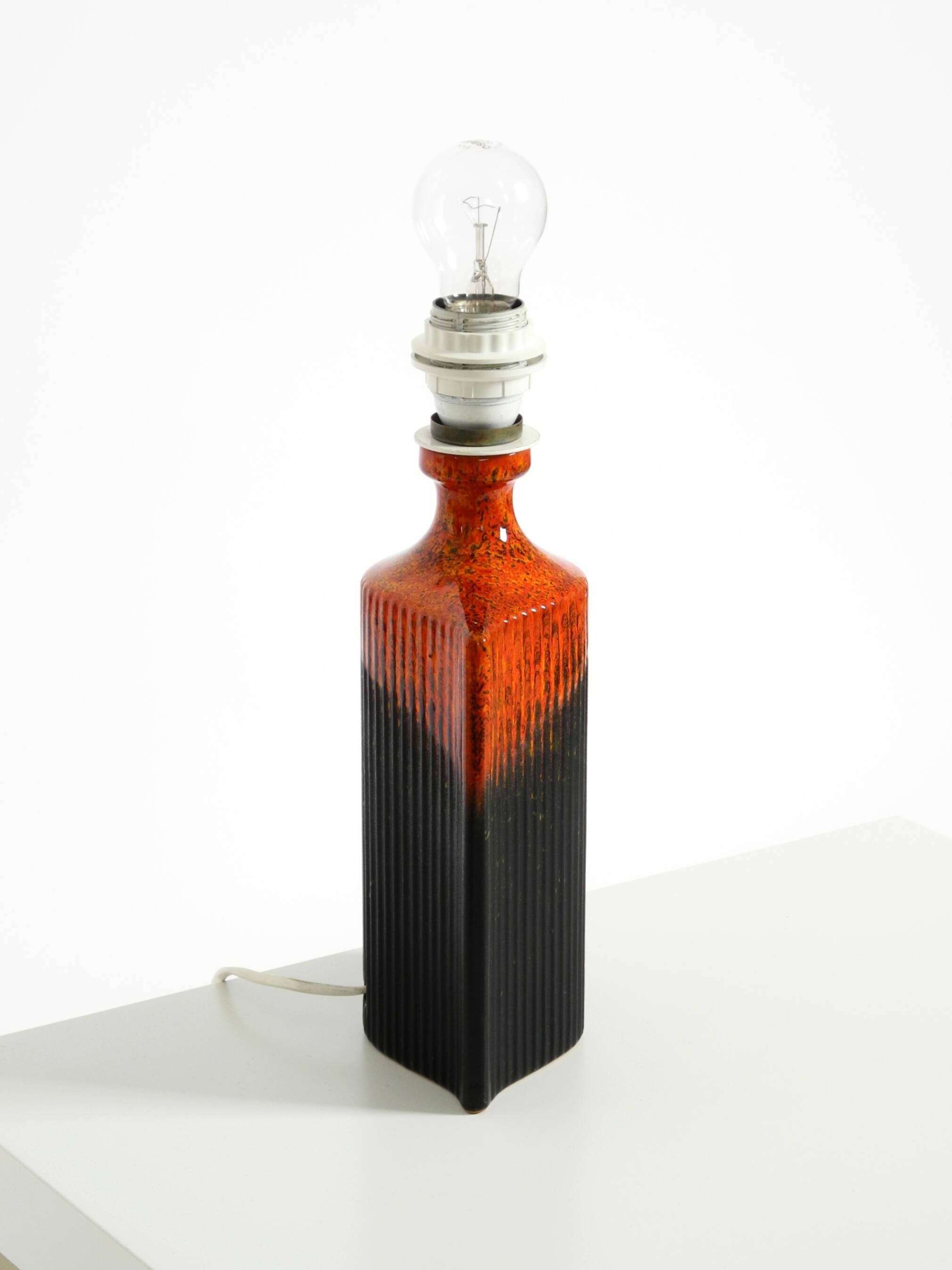 Unique 1960s ceramic table lamp in red and black by Kaiser Leuchten