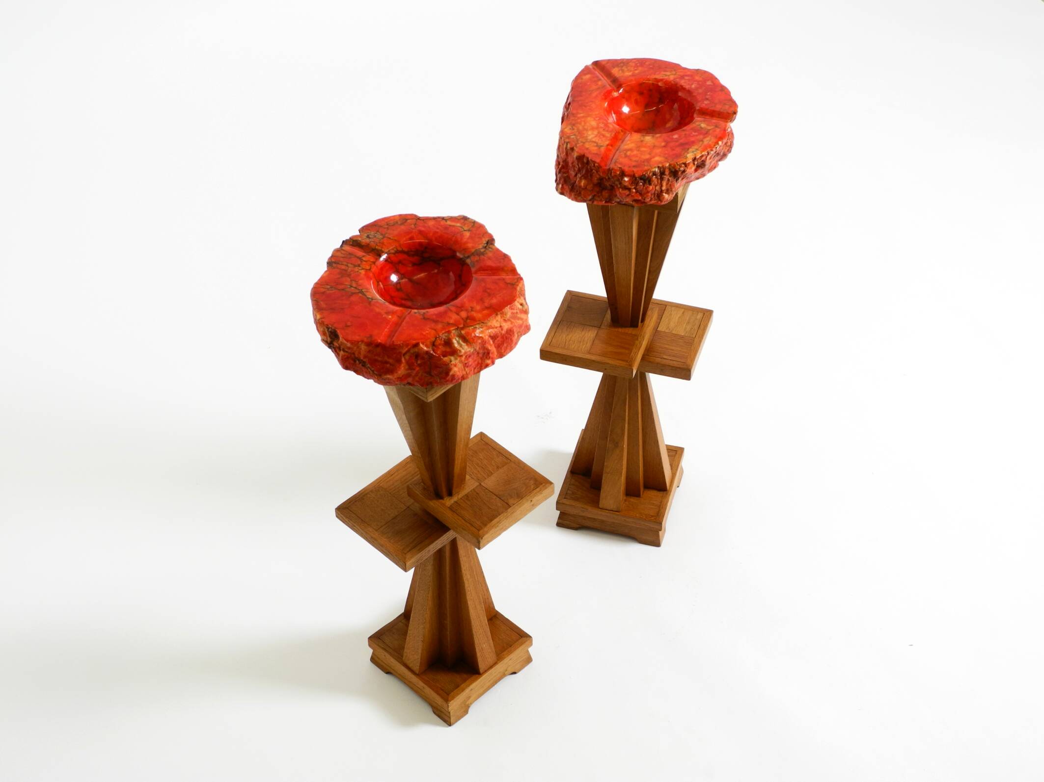 Two mid-century standing ashtrays consisting of red Alabaster cup