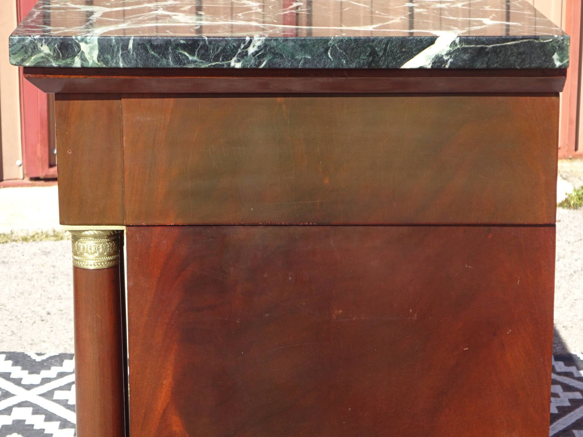 Flamed mahogany enfilade with sea green marble in Empire style.