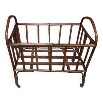 Old small bed or cradle for baby in vintage rattan