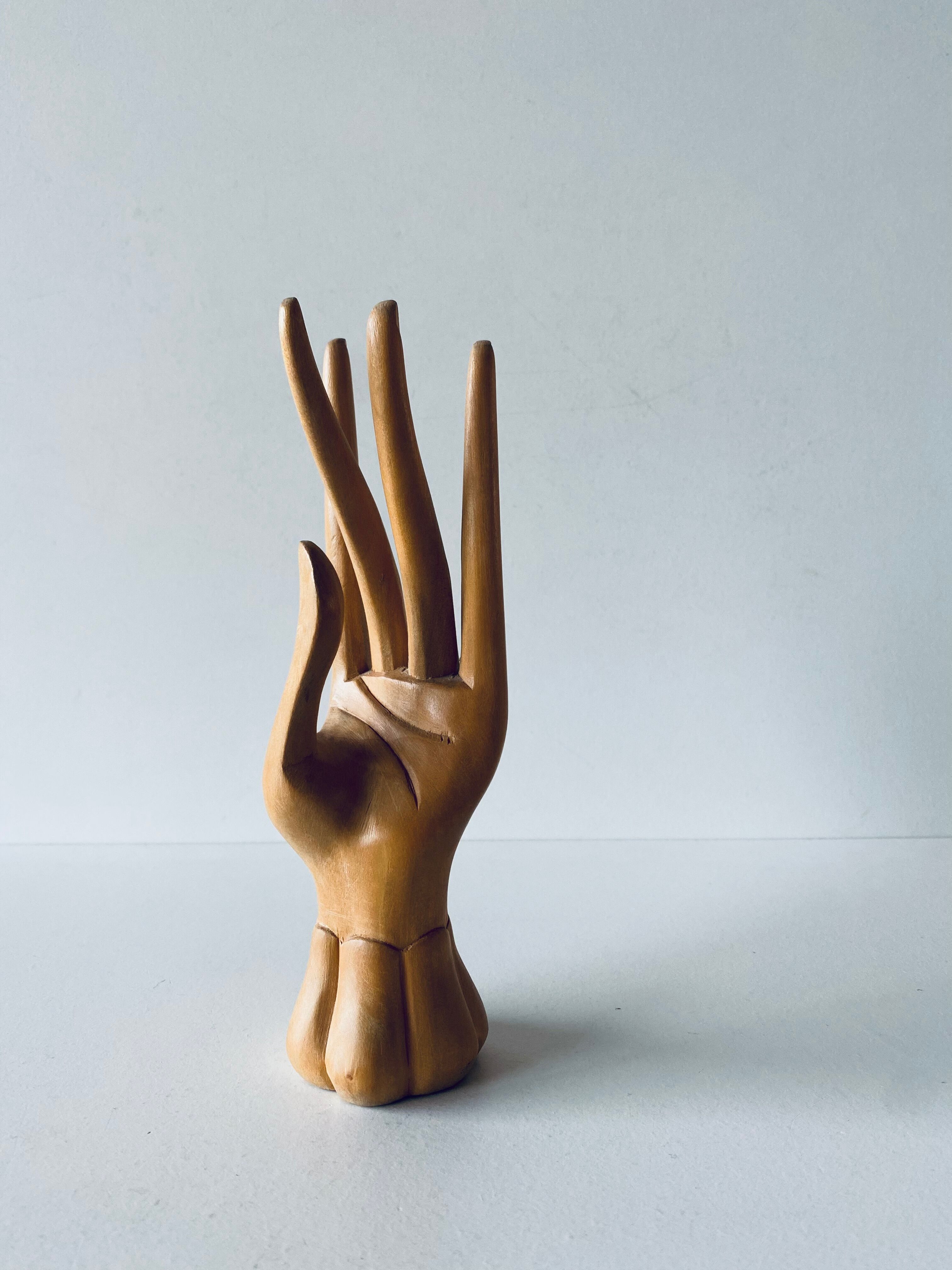 Decorative hand in carved wood