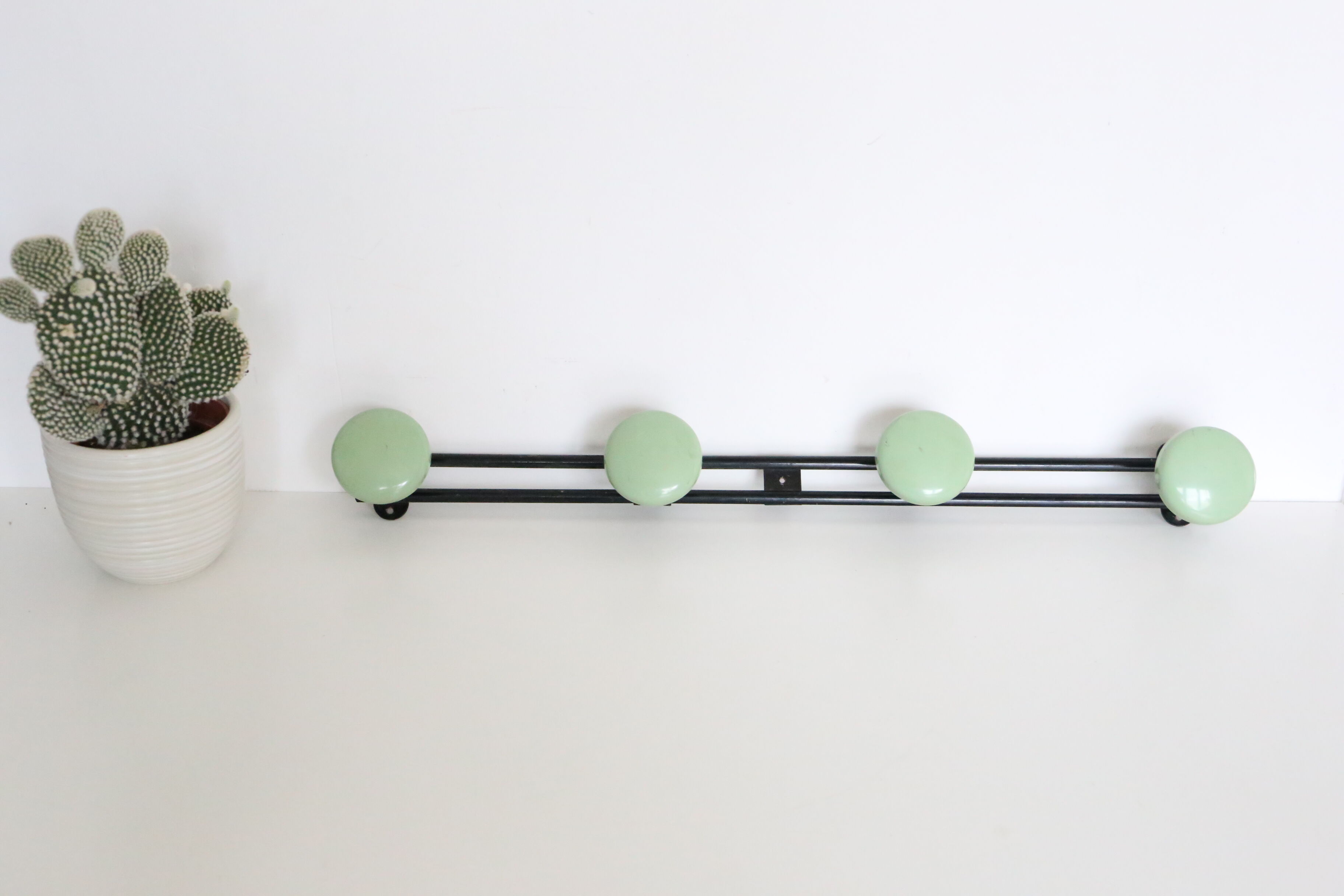 Metal, green and black, vintage wall coat holder