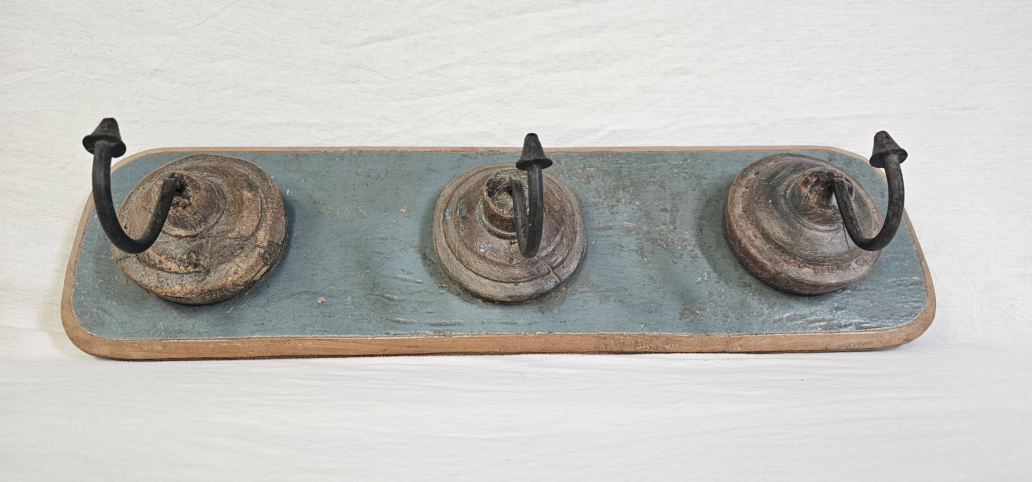 Antique teak coat rack with 3 wrought iron hooks