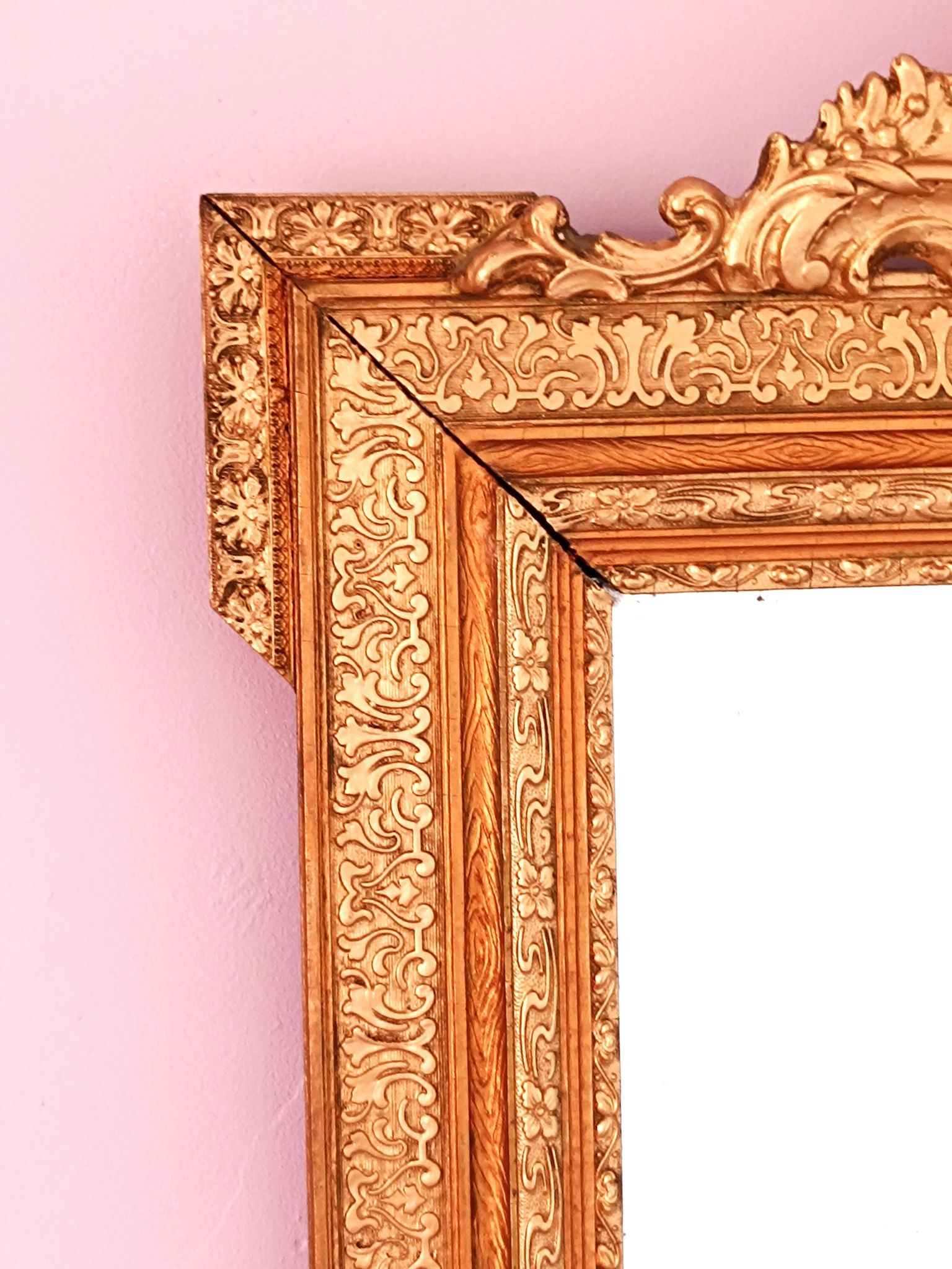 Napoleon III mirror with rich gilded ornamentation