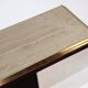 Minimalist console in travertine and patinated metal — 1970s