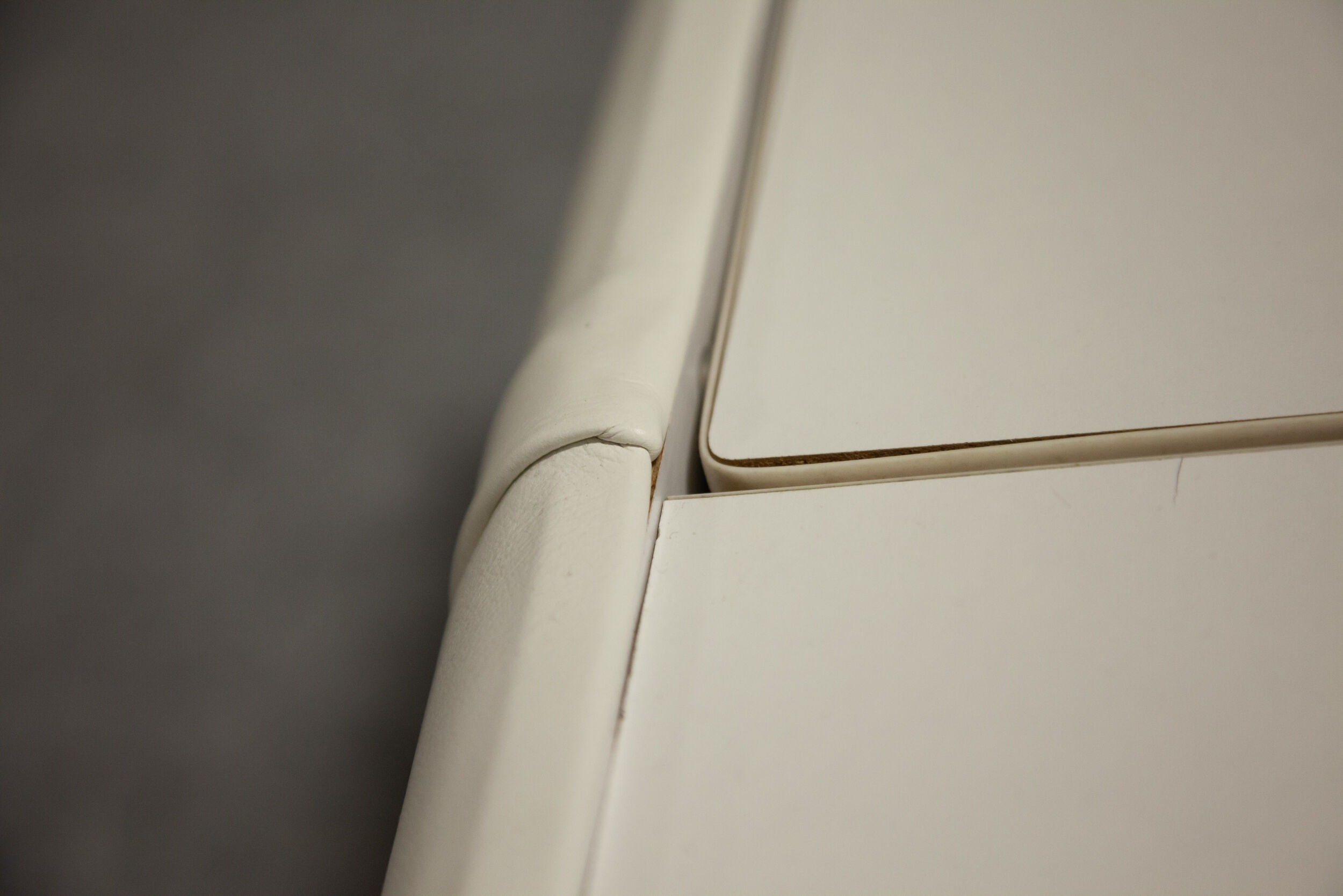 Pair of 70s white leather bedsides
