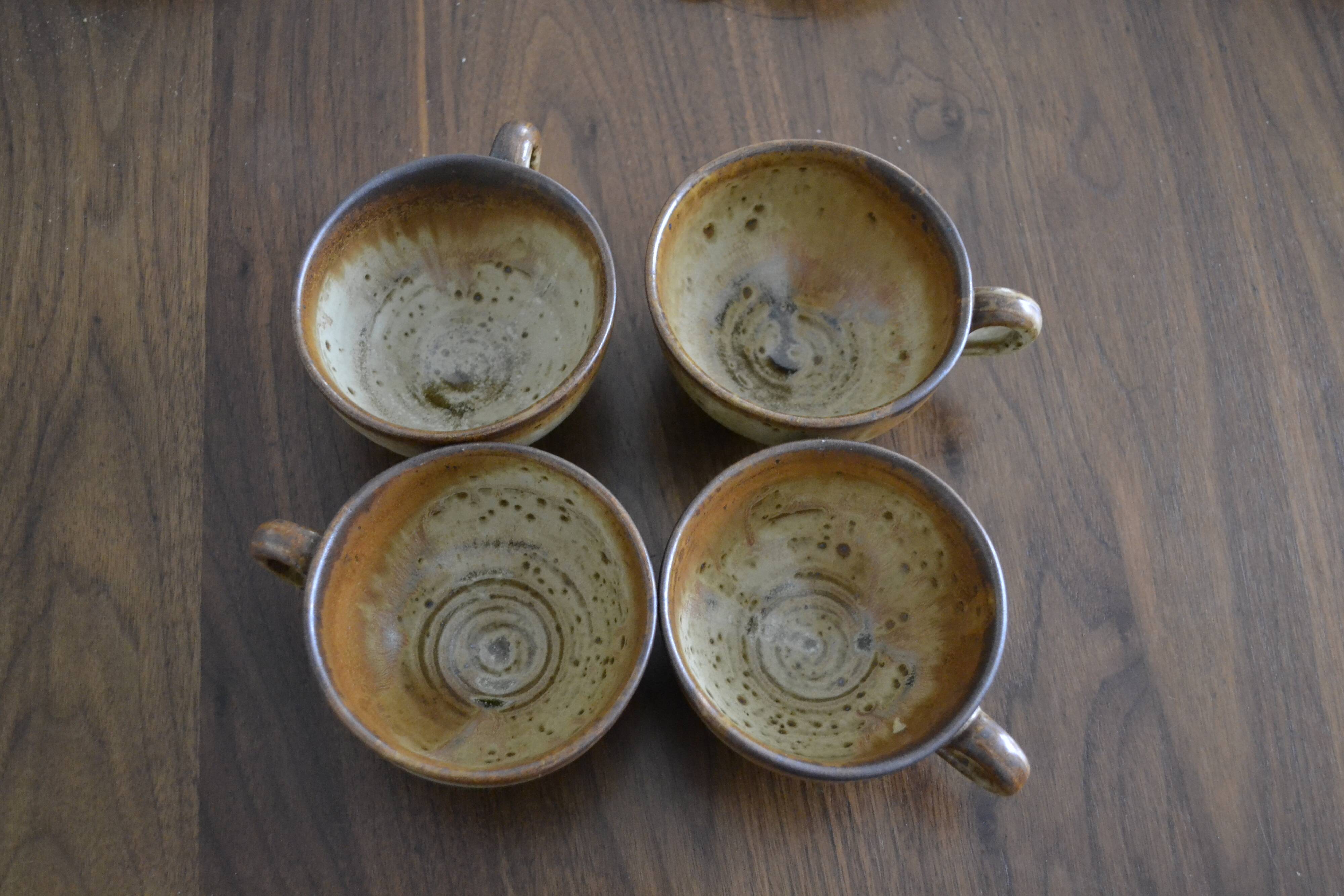 Set of 4 signed sandstone cups