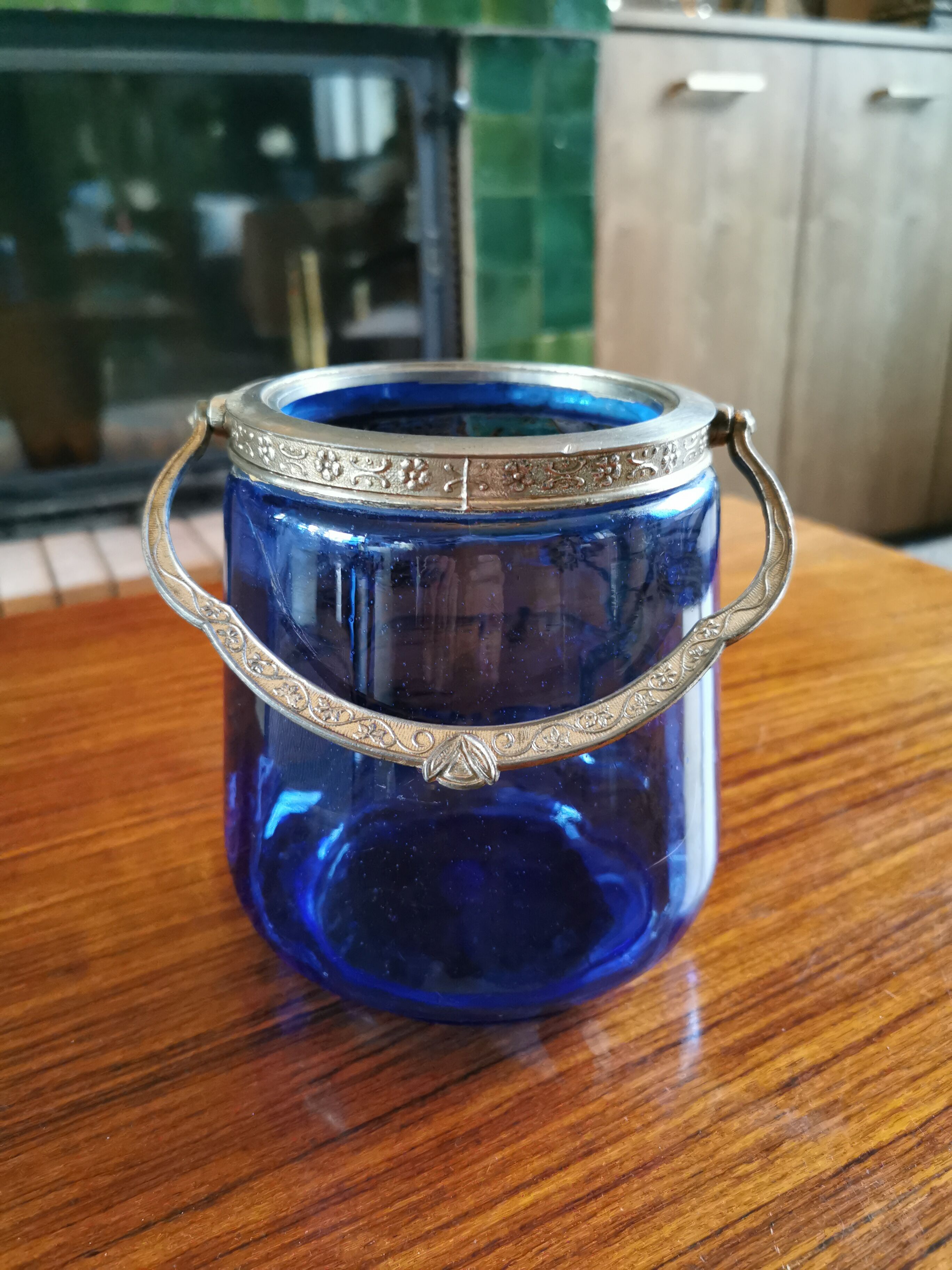 Old ice or biscuit bucket made of golden decor blue glass