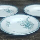 Set of three iron earthenware plates from the St Amandinoise earthenware factory, lily of the valley model.