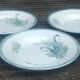 Set of three iron earthenware plates from the St Amandinoise earthenware factory, lily of the valley model.