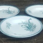 Set of three iron earthenware plates from the St Amandinoise earthenware factory, lily of the valley model.