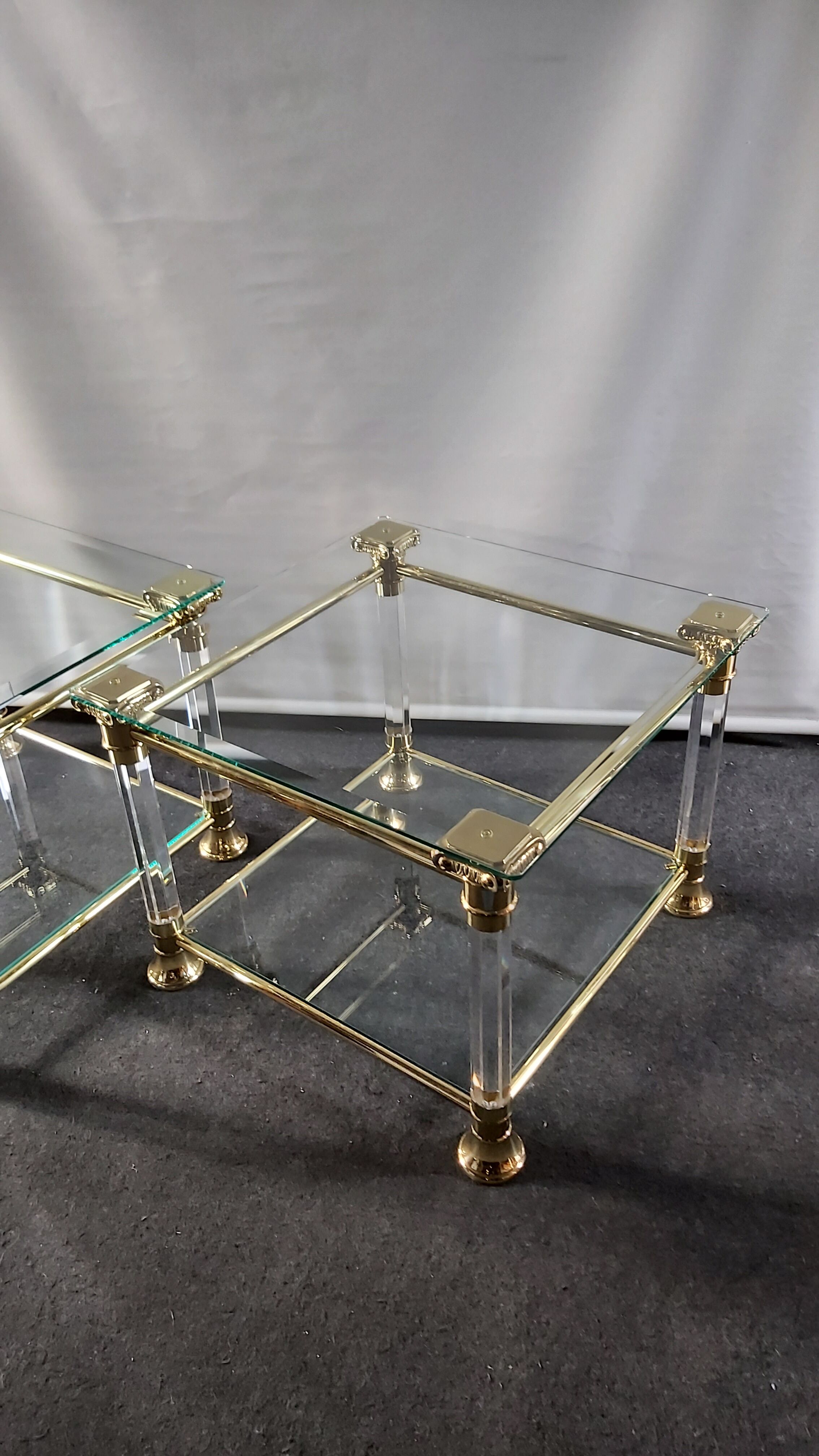Pair of tables in brass, acrylic and glass