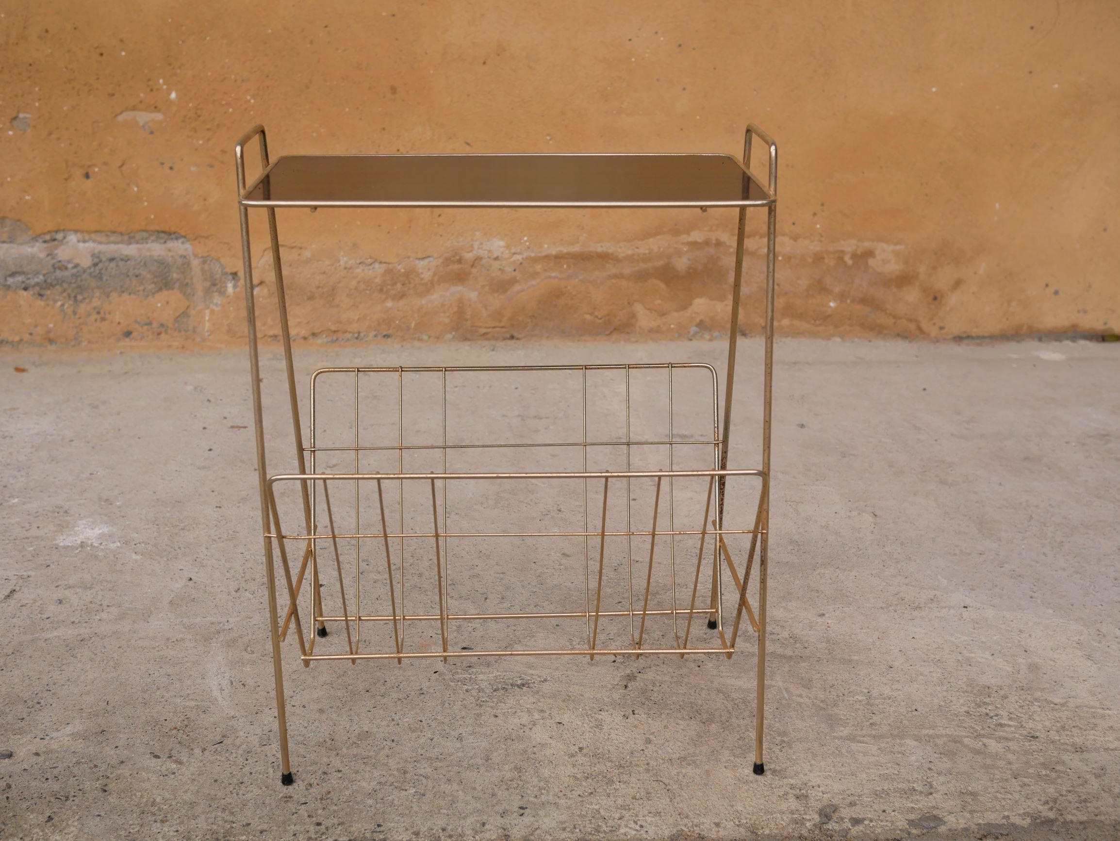 Vintage gold metal magazine rack