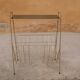 Vintage gold metal magazine rack