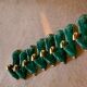8 knife-wielding gazelles dabbling in green enamelled ceramic and vintage gold 1950